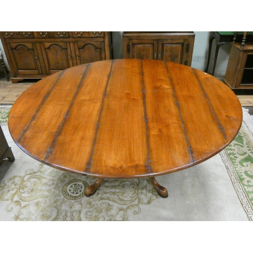 394 - Circular Georgian style cherry wood dining table on quatreform pedestal base. Top is 64