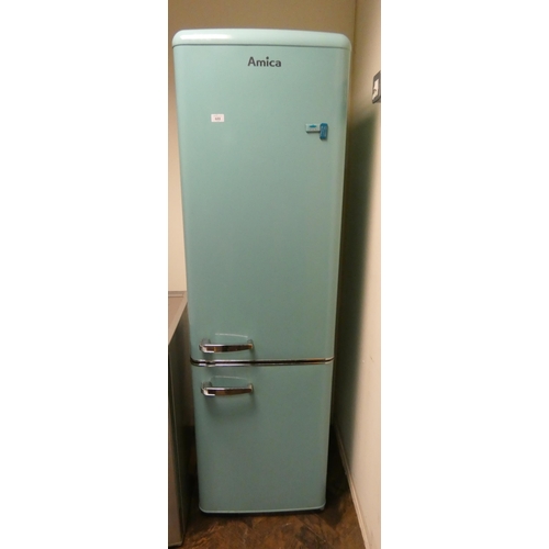 688 - A tall Amica turquoise and chrome finish fridge freezer with larger fridge compartment to top...