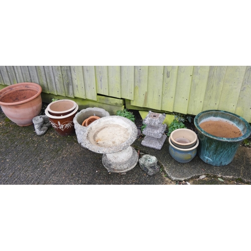 701 - Five assorted ceramic garden pots, one clay, one stone, small low garden baths etc...