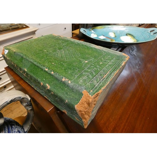 194 - A carved wooden reclining Buddha figure, a Majolica dish and a book shaped Victorian tile dated 1899