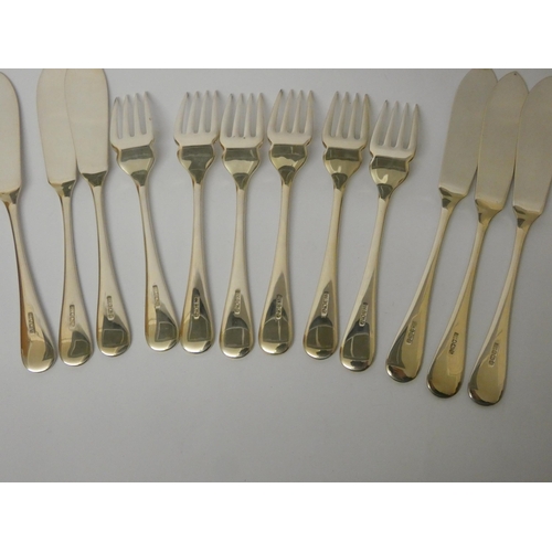 629 - A set of modern hallmarked silver old English pattern fish knives and forks, unused. Gross weight 23... 