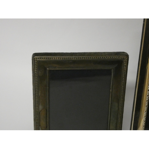 638 - Two modern silver rectangular photo frames, the largest is 23cms tall