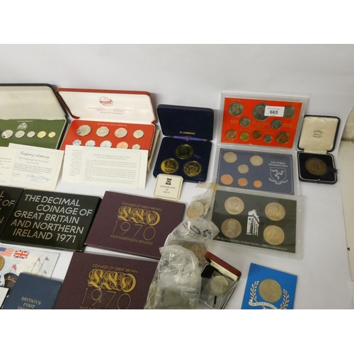 665 - An accumulation of proof sets, specimen sets,  commemorative crowns, odd coins etc