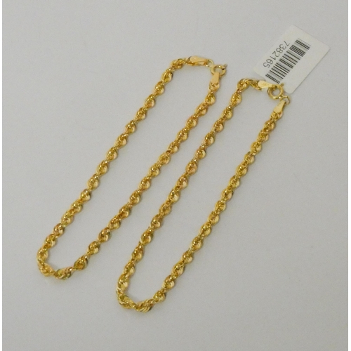 453 - A pair of 9ct gold bright cut rope chain bracelets, 2.5gms