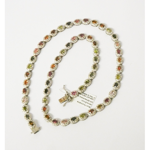 455 - A rainbow Tourmaline cluster necklace in platinum plated sterling silver, unworn with tag and certif... 