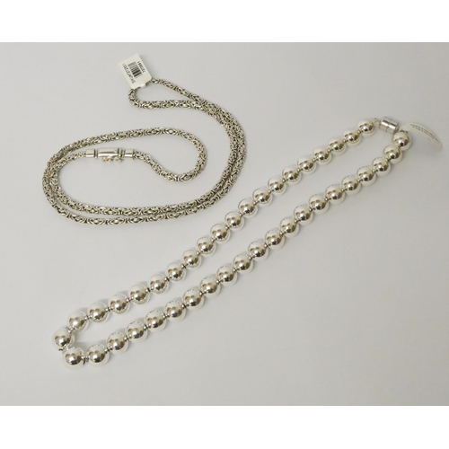 457 - Modern silver bead necklace and a long plaited silver neck chain, beaded length 51cms, plaited 77cms... 