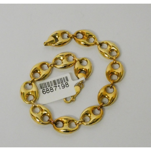 477 - A modern 9ct gold anchor link chain bracelet, 22cms long, gross weight 9.1gms, unworn with tags