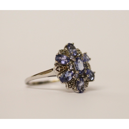 479 - 9ct white gold oval tanzanite cluster dress ring, ring size O, gross weight 2.9gms