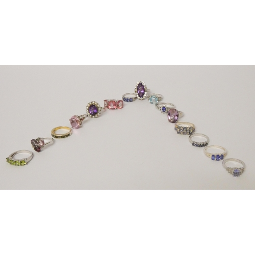 491 - A collection of 15 silver and gemstone set dress ring in a fitted box