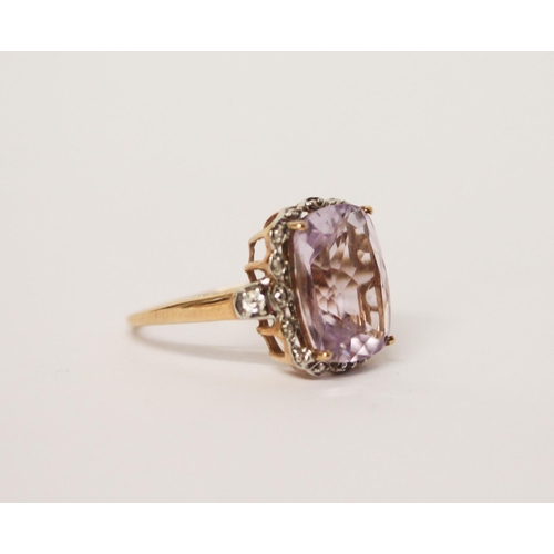 493 - A 9ct gold diamond and large faceted purple stone dress ring, ring size O