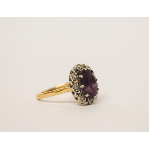 494 - An 18ct gold amethyst and diamond oval cluster ring, hallmarked, ring size M