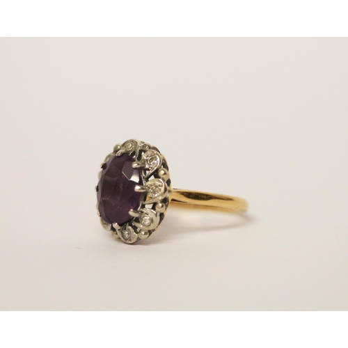 494 - An 18ct gold amethyst and diamond oval cluster ring, hallmarked, ring size M