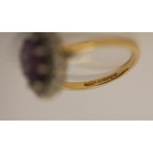 494 - An 18ct gold amethyst and diamond oval cluster ring, hallmarked, ring size M