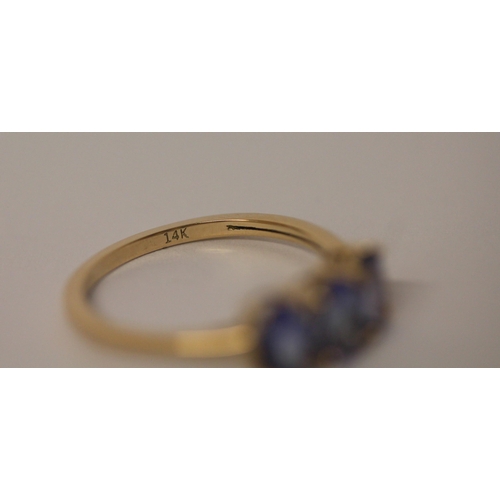 496 - 14ct gold three stone tanzanite dress ring, ring size L