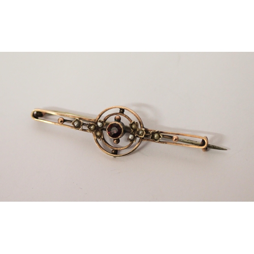 547 - Edwardian 9ct rose gold bar brooch set with garnet and seed pearls, marked '9c', 3.2g