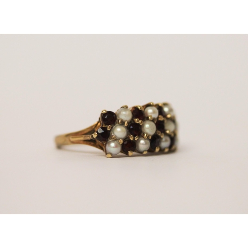 562 - A large garnet and pearl cluster ring designed as a wide band, 9ct gold, marks worn, Size M, weight ... 