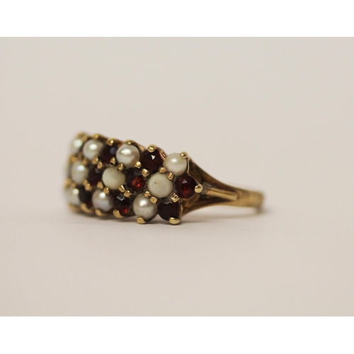 562 - A large garnet and pearl cluster ring designed as a wide band, 9ct gold, marks worn, Size M, weight ... 