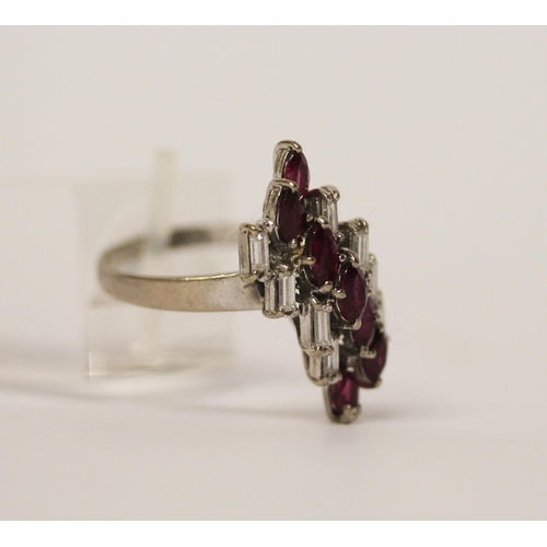 564 - A vintage ruby and diamond cluster cocktail ring, in an offset panel, on 18ct white gold band, marke... 