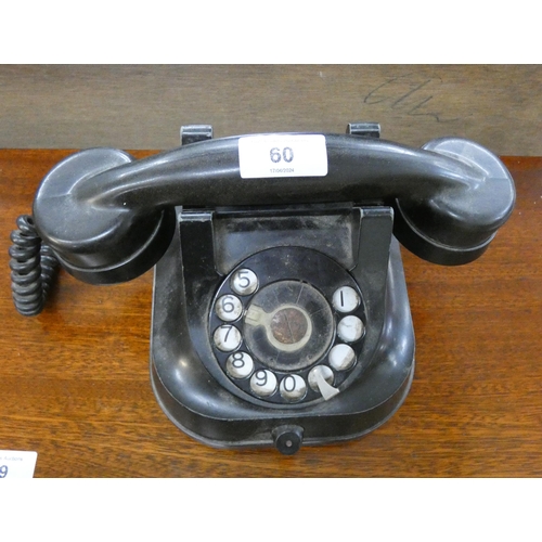 60 - An old heavy black Bakelite telephone