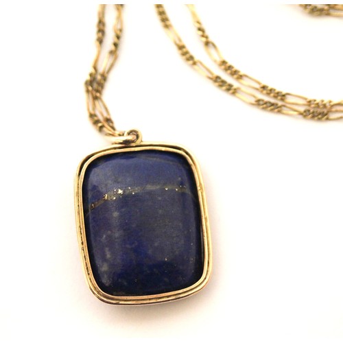 525 - An Etruscan Revival lapis, rock crystal and gold mounted cameo pendant, carved in relief as a Greek ... 