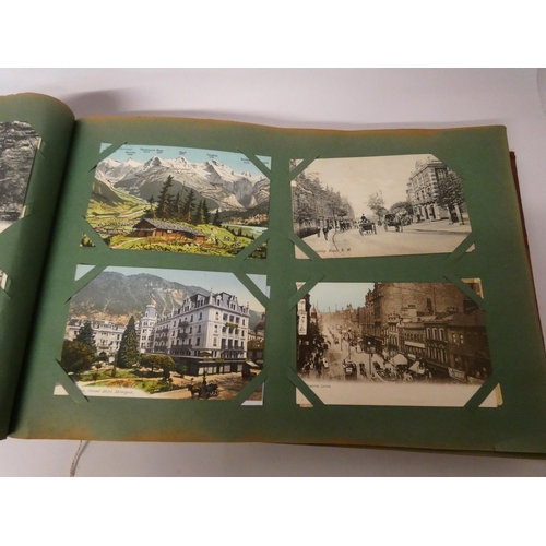 253 - Vintage postcard album and contents of early 20th century souvenir topographical postcards, over 300... 