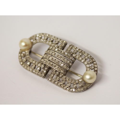 582 - An Art Deco diamond and pearl brooch by Marzo Paris, signed, circa 1920, pave set with diamonds with... 