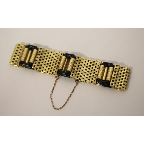 583 - An Art Deco 14ct yellow gold and black onyx link bracelet, invisible clasp & safety chain fitted. Ma... 