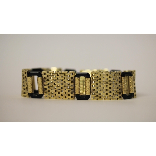 583 - An Art Deco 14ct yellow gold and black onyx link bracelet, invisible clasp & safety chain fitted. Ma... 