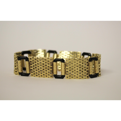 583 - An Art Deco 14ct yellow gold and black onyx link bracelet, invisible clasp & safety chain fitted. Ma... 