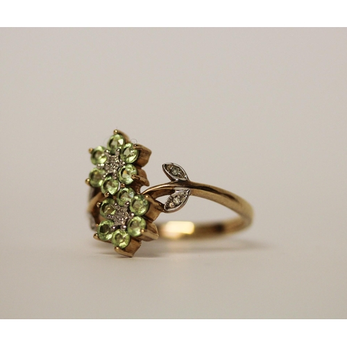 586 - Unusual peridot and diamond double daisy dress ring on hallmarked 9ct gold band. Ring size P, gross ... 