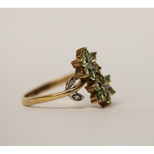 586 - Unusual peridot and diamond double daisy dress ring on hallmarked 9ct gold band. Ring size P, gross ... 