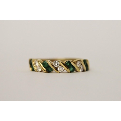 587 - 18ct yellow gold emerald and diamond half hoop eternity ring, hallmarked, ring size M, gross weight ... 