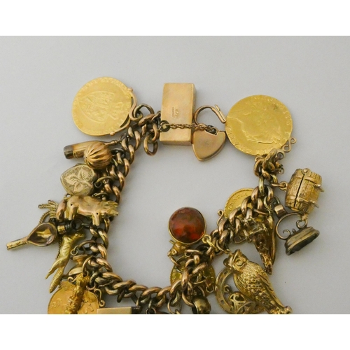 589 - A good charm bracelet, set with two Gold Spade Guineas, 1912 Gold half Sovereign, George III Gold Th... 