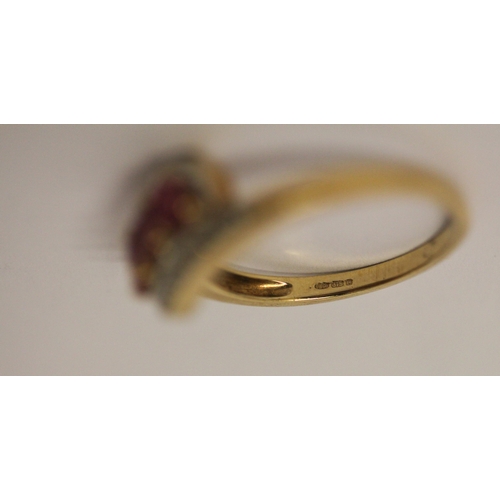 596 - A three stone ruby and diamond dress ring, on hallmarked 9ct gold band, Ring size N, with older styl... 