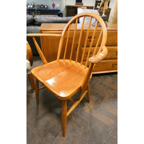 162 - An Ercol hoop stick back elbow chair and a matching dining chair