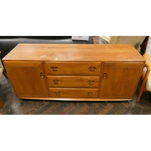 163 - An Ercol blonde elm sideboard fitted three central drawers with cupboards either end, raised on cast... 