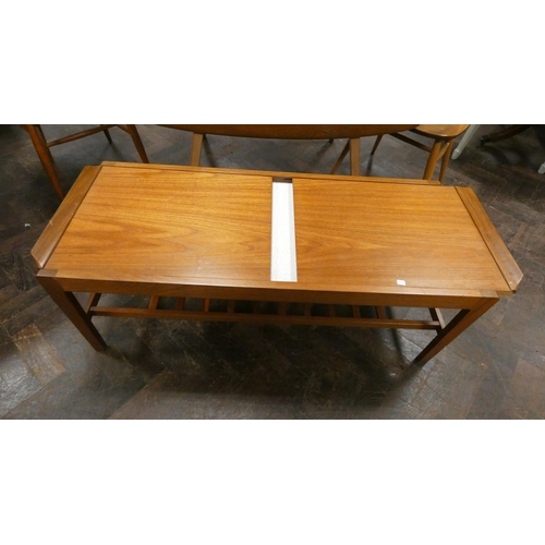 166 - A vintage Remploy teak two tier coffee table with sliding compartments and Formica inset, 44