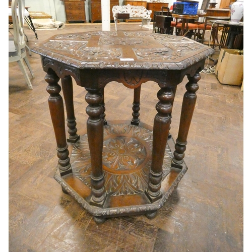 176 - An octagonal antique oak two tier occasional table, 30.5