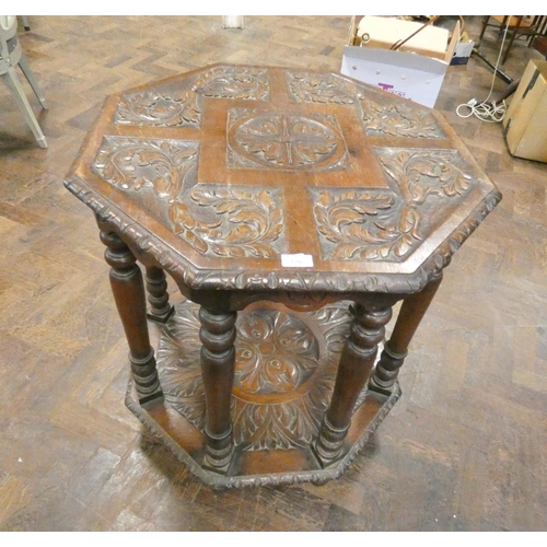 176 - An octagonal antique oak two tier occasional table, 30.5