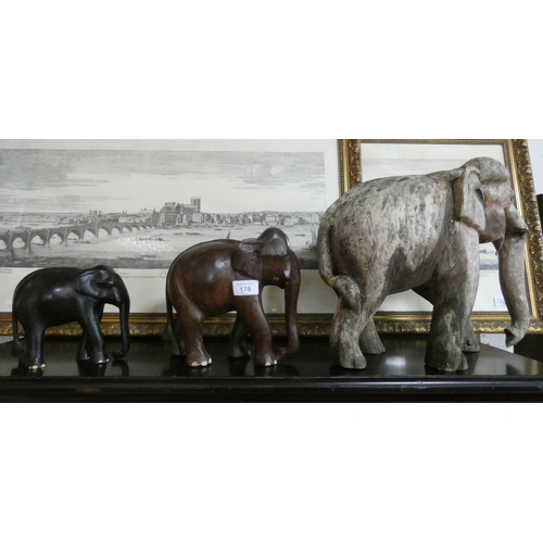 178 - Three wooden carved elephant figurines of various sizes