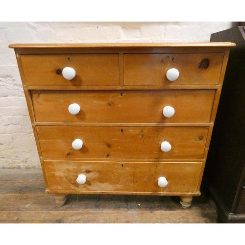 179 - An antique stripped and waxed pine chest of two short and three long drawers with white ceramic hand... 