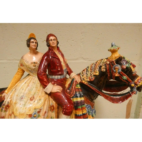 235 - Antonio Peyro Mezquita - a large coloured terracotta figure of a Spanish couple in traditional dress... 