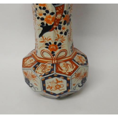 243 - A large Imari octagonal bodied flared rim vase