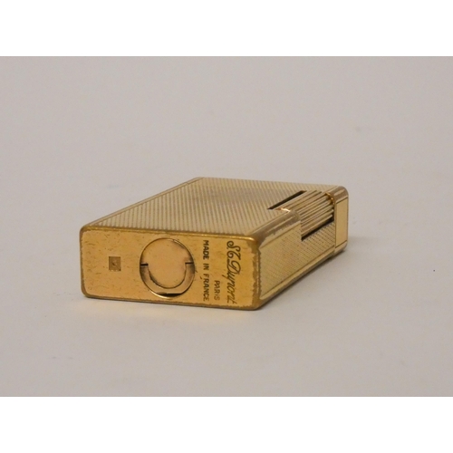 248 - Dupont gold plated lighter with engine turned decoration.