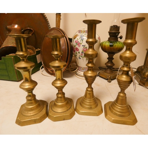 398 - Two pairs of old brass candlesticks