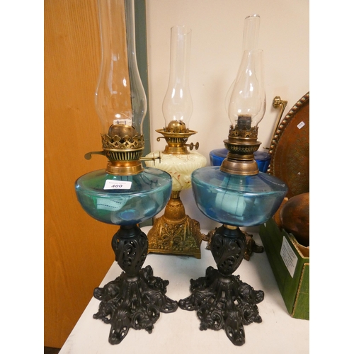 400 - Very near pair of Victorian oil lamps on black wrought iron bases with green reservoirs