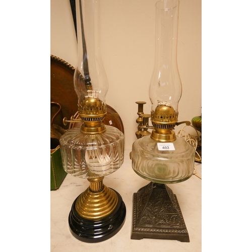 402 - Two Victorian oil lamps with clear glass reservoirs