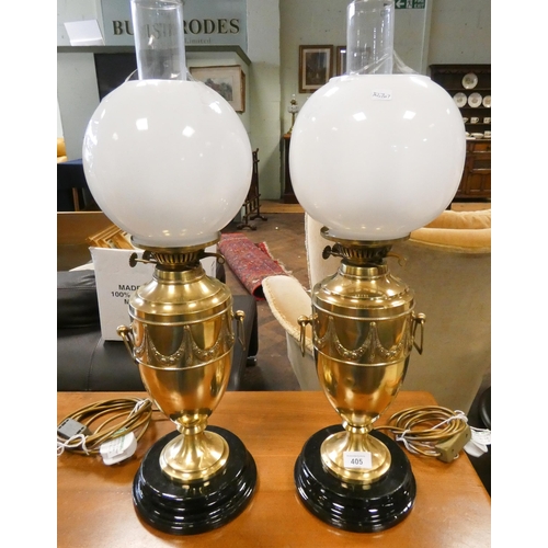 405 - A pair of early 20th century brass urn shaped oil lamps converted to electricity