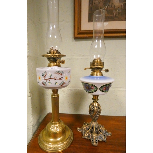 406 - Two Victorian oil lamps with painted milk glass shades