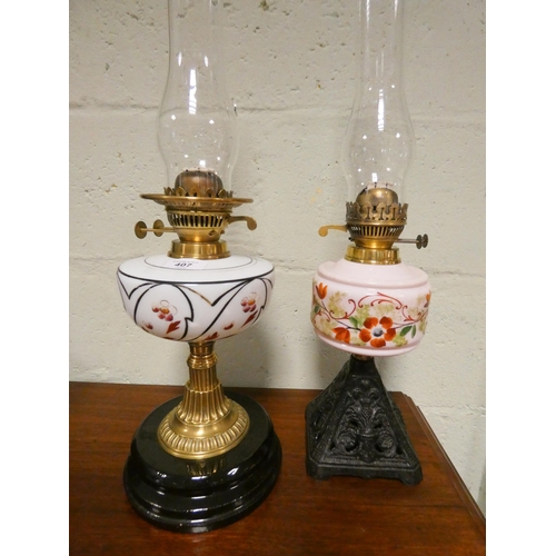 407 - Two Victorian oil lamps with painted milk glass shades